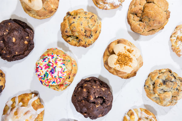 Assorted cookies on a white marble countertop