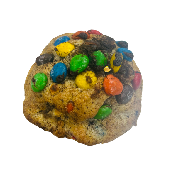 Cookie with M&M candies on a white background