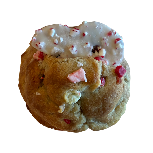 Cookie with white icing and red and pink sprinkles on a white background