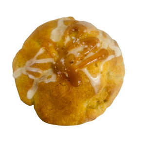Round pastry with caramel and white icing on a white background