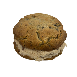 Cookie sandwich with cream filling on a white background