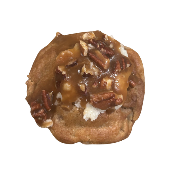 Pecan-topped cookie on a white background