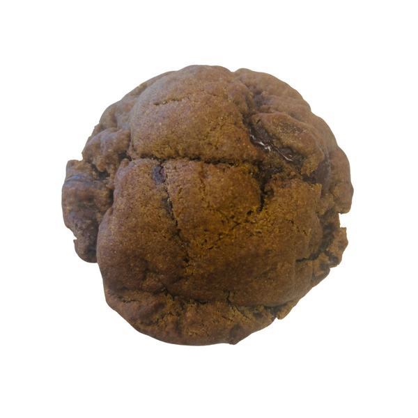 This is a darker brown round shaped cookie with semi-sweet chocolate discs visible on the surface and throughout.  