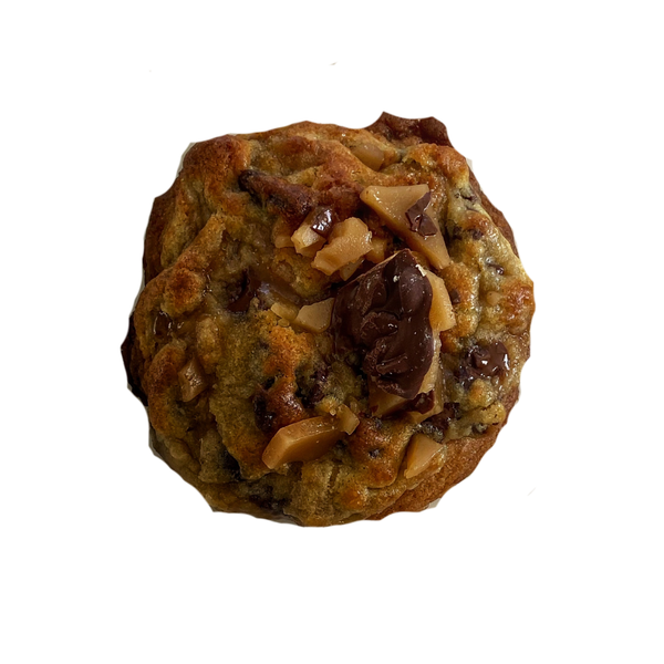 Cookie with nuts and chocolate chips on a white background